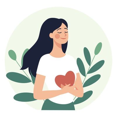 Woman holding a heart illustration representing self-esteem and identity therapy in Ontariond emotional healing