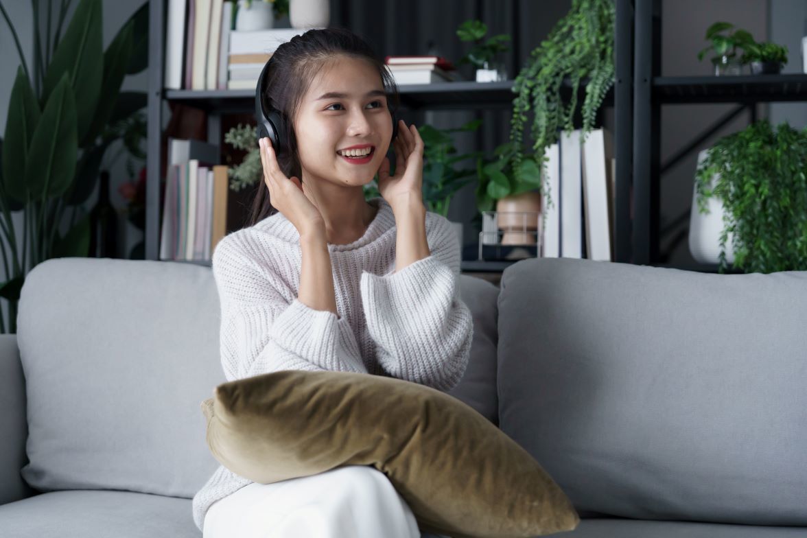 Headphones and phone playing cult recovery and psychology podcasts