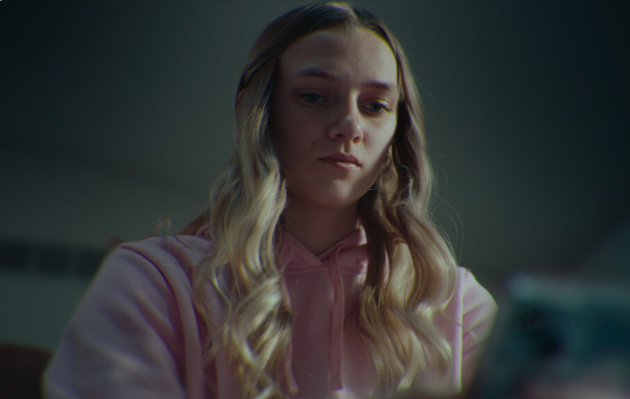 Young woman reflecting alone, representing trauma recovery after parental enmeshment