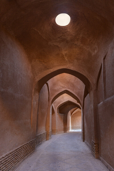 narrow repeating arched passageway